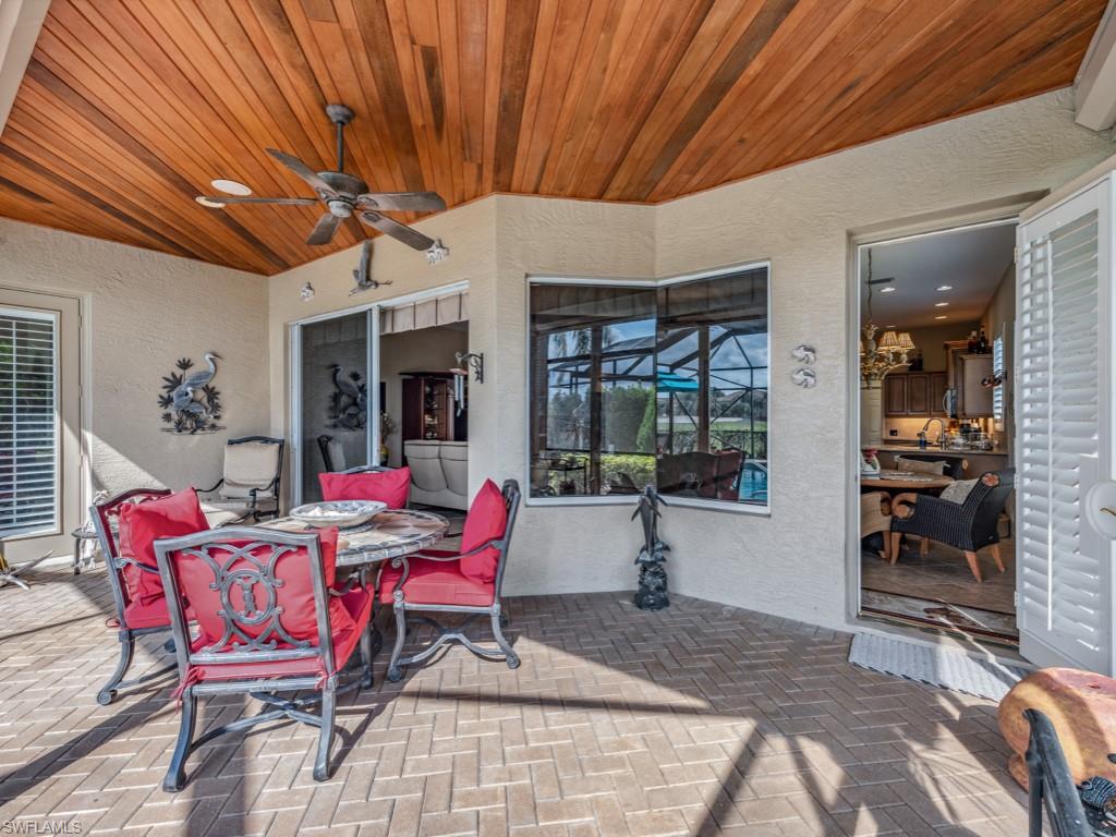 6048 Fairway Court Naples, FL 34110 - Photo 3 of 49 a view of a dining room with furniture and window