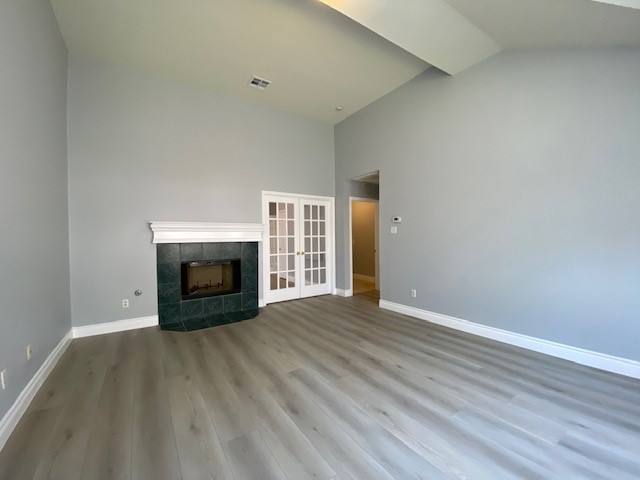 1512 Lorson Loop Round Rock, TX 78665 - Photo 13 of 29 a view of empty room with wooden floor and fireplace
