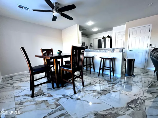 a view of a dining room with furniture