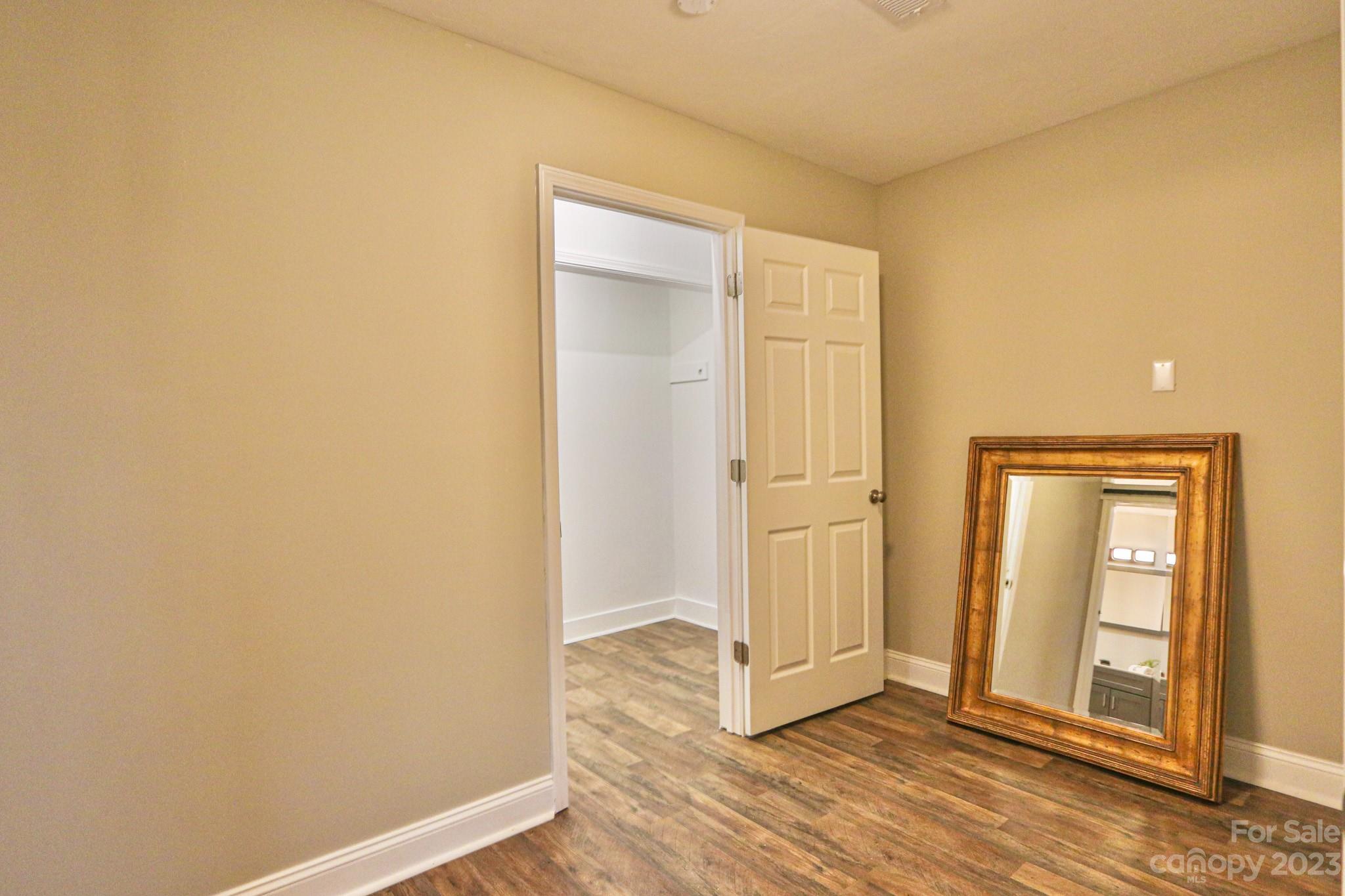 219 Harris Avenue Elkin, NC 28621 - Photo 20 of 48 an empty room with wooden floor and closet area