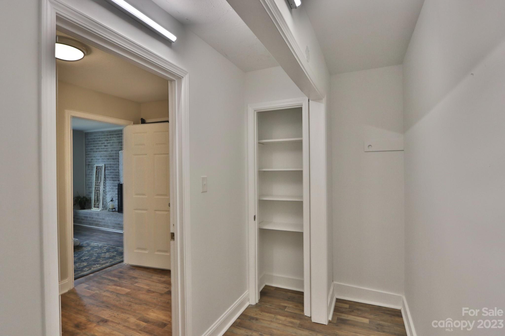 219 Harris Avenue Elkin, NC 28621 - Photo 23 of 48 a view of a hallway with wooden floor and entryway
