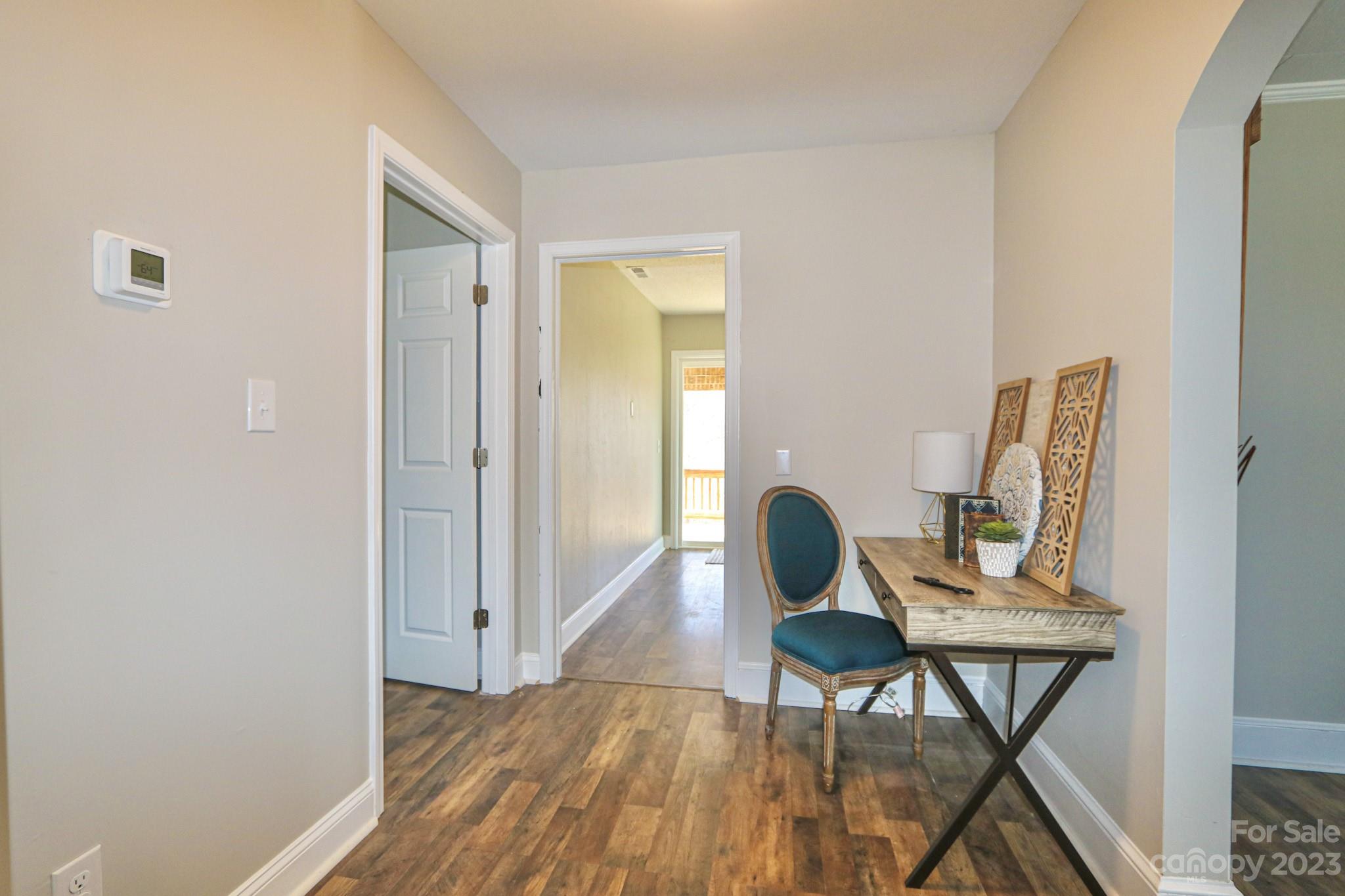 219 Harris Avenue Elkin, NC 28621 - Photo 25 of 48 a workspace room with furniture and wooden floor