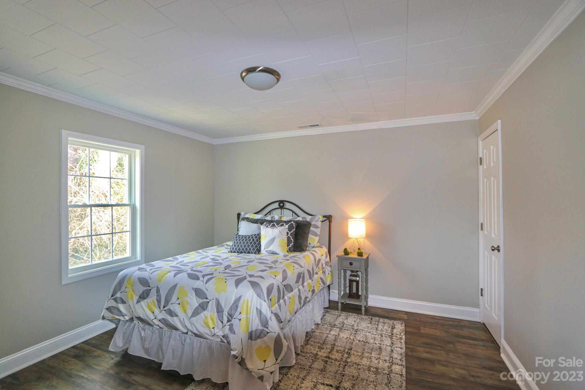 219 Harris Avenue Elkin, NC 28621 - Photo 26 of 48 a bedroom with a bed and a window