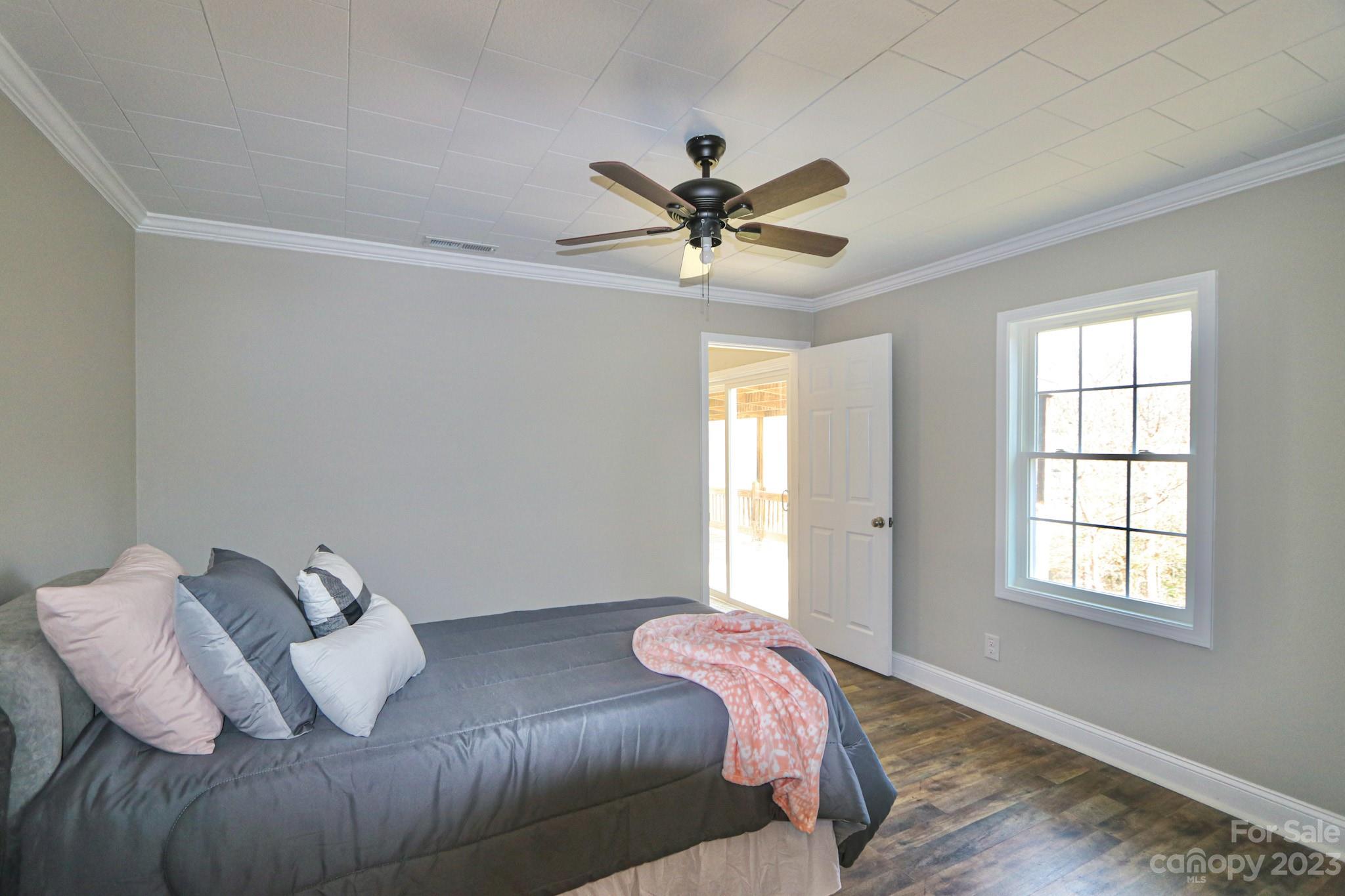219 Harris Avenue Elkin, NC 28621 - Photo 30 of 48 a bedroom with a bed and a window