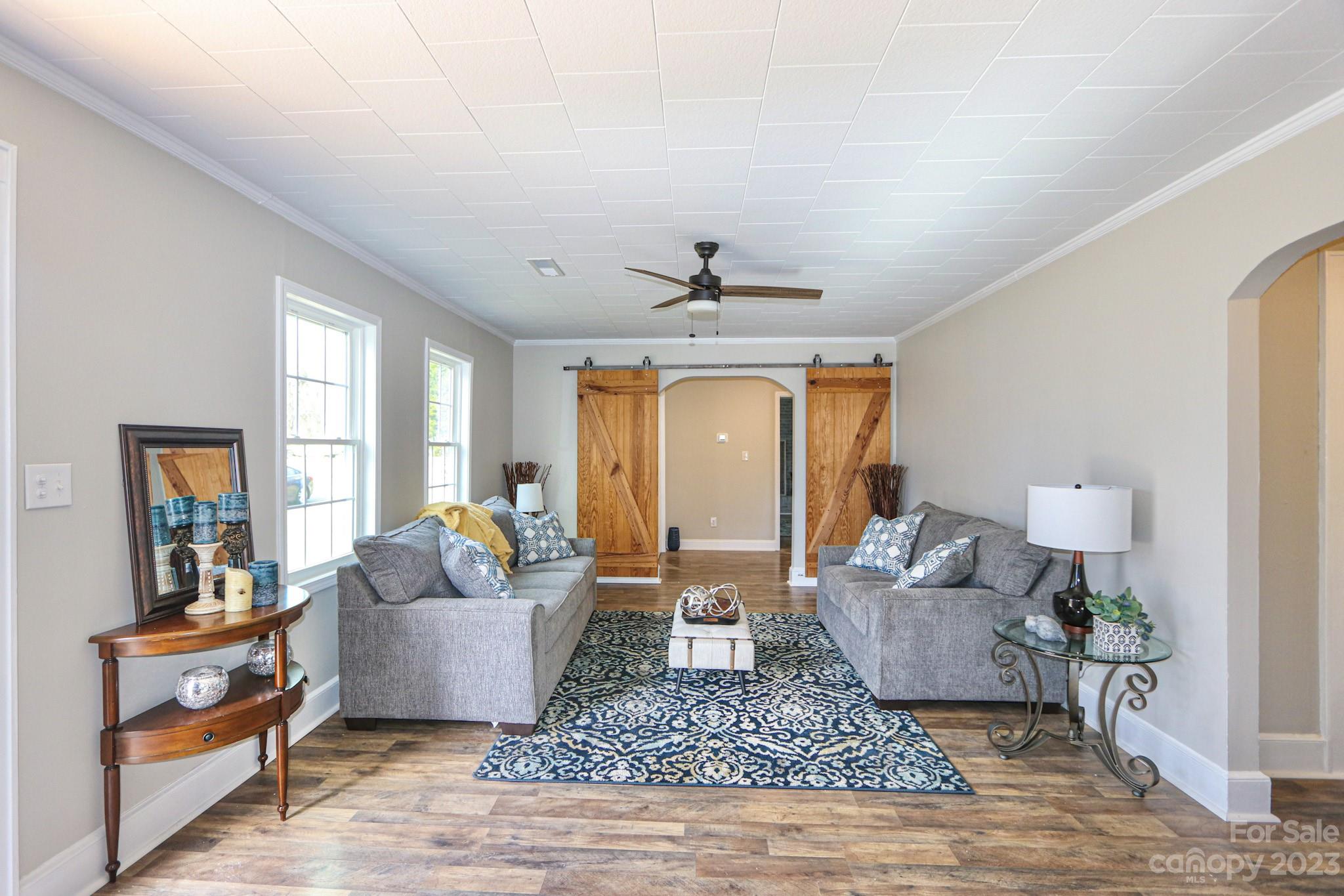 219 Harris Avenue Elkin, NC 28621 - Photo 3 of 48 a living room with furniture and a rug