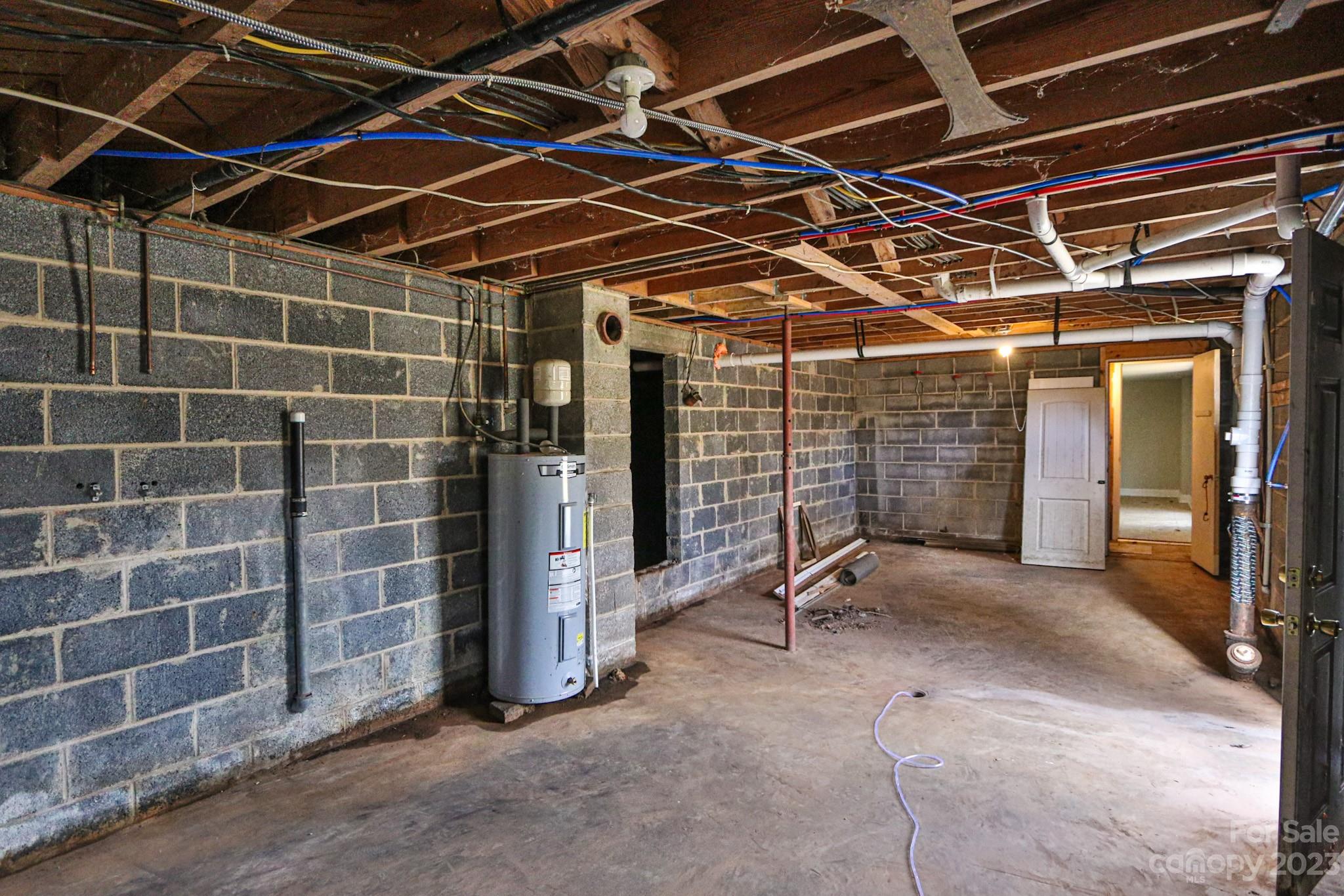 219 Harris Avenue Elkin, NC 28621 - Photo 40 of 48 a view of empty room with wooden wall