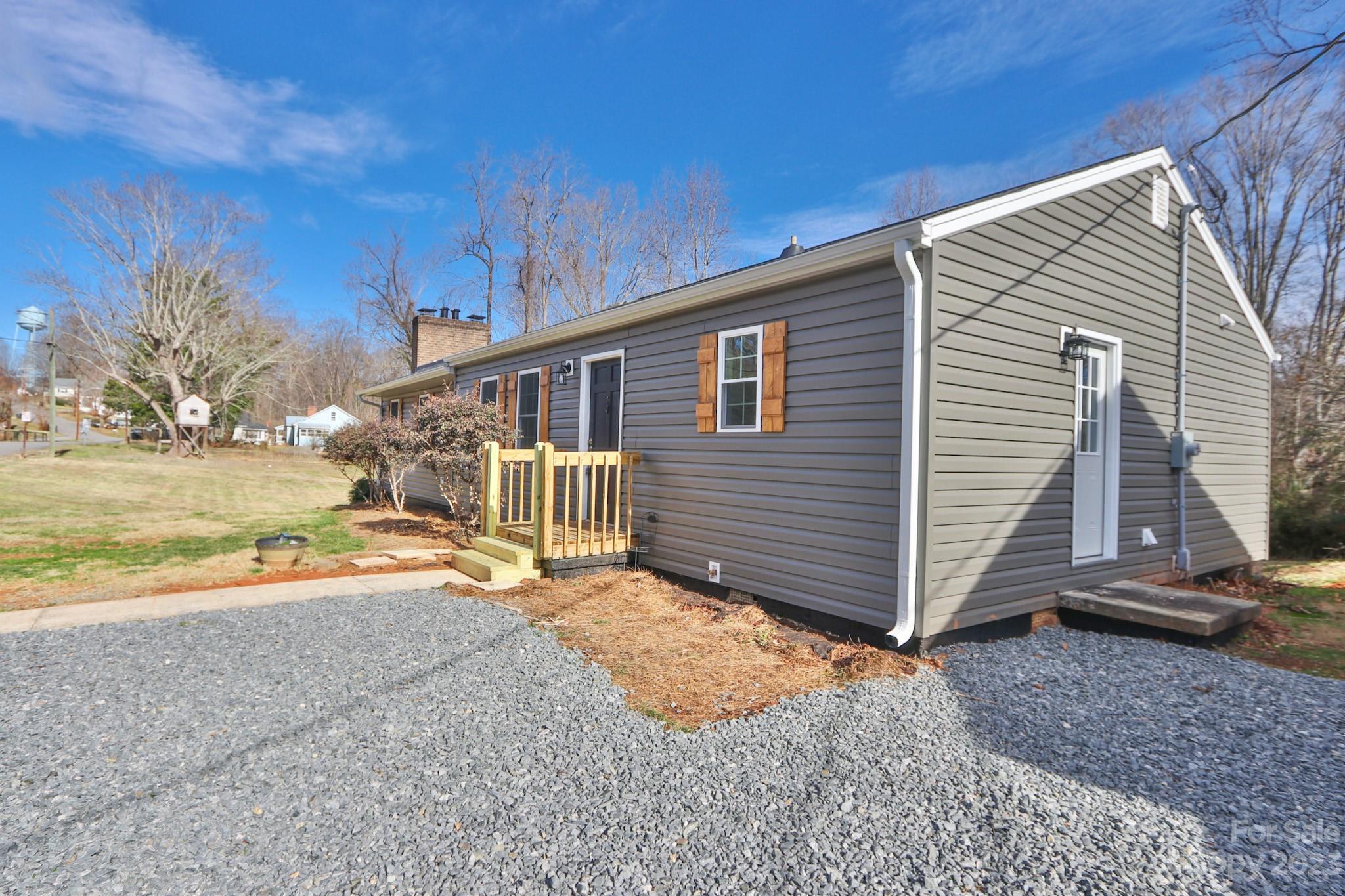 219 Harris Avenue Elkin, NC 28621 - Photo 46 of 48 a view of a house with backyard and wooden fence