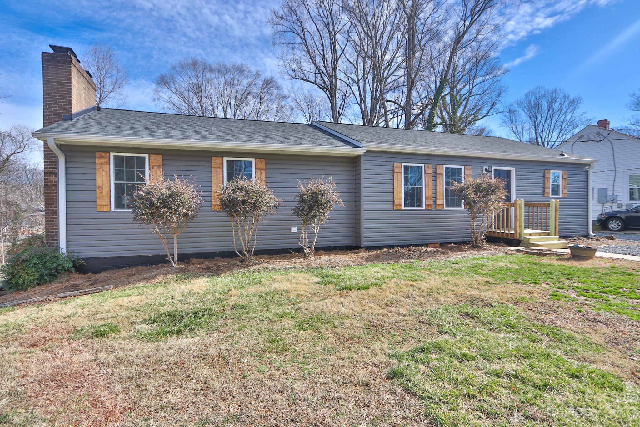 219 Harris Avenue Elkin, NC 28621 - Photo 5 of 48 a front view of a house with garden