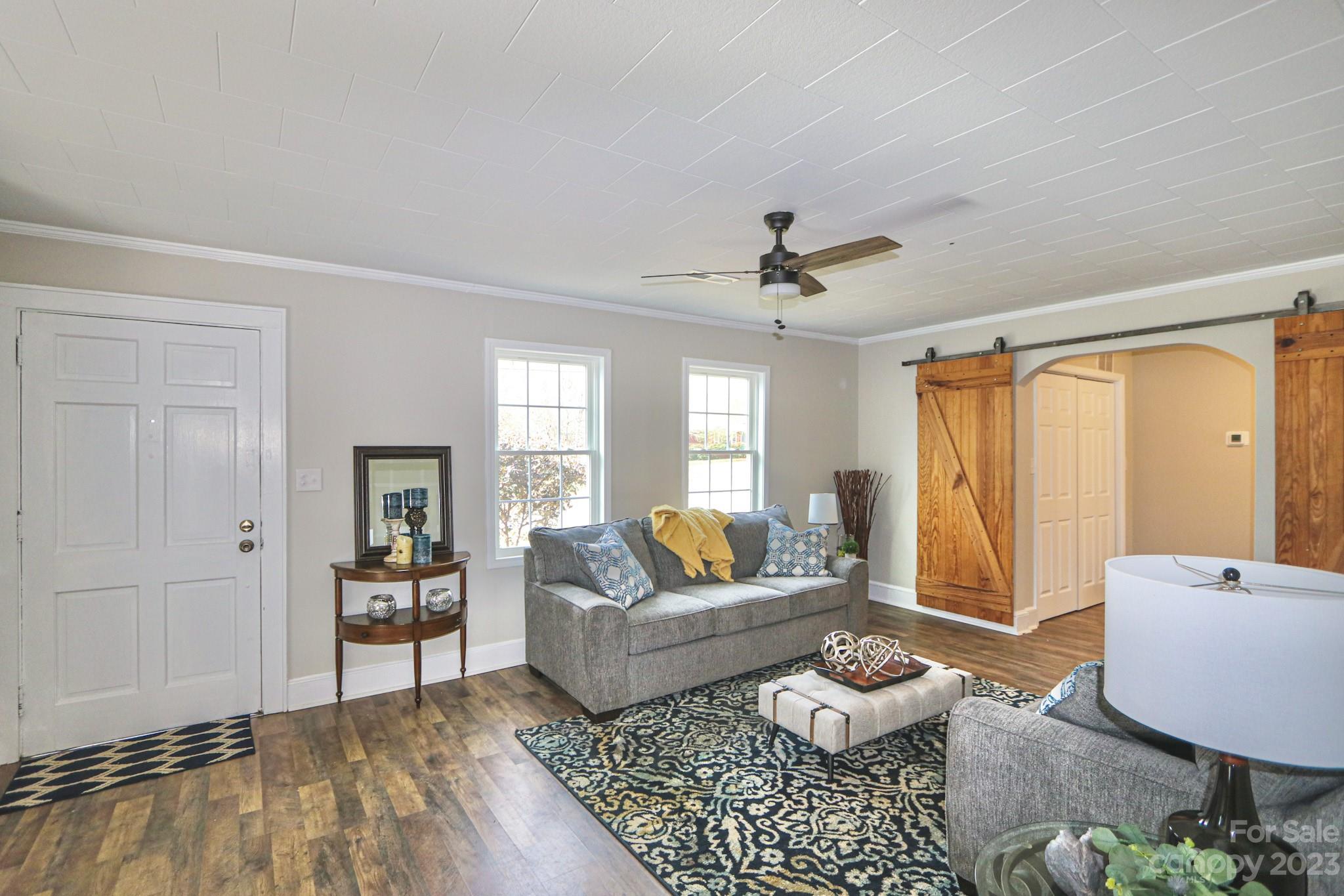 219 Harris Avenue Elkin, NC 28621 - Photo 8 of 48 a living room with furniture and a rug