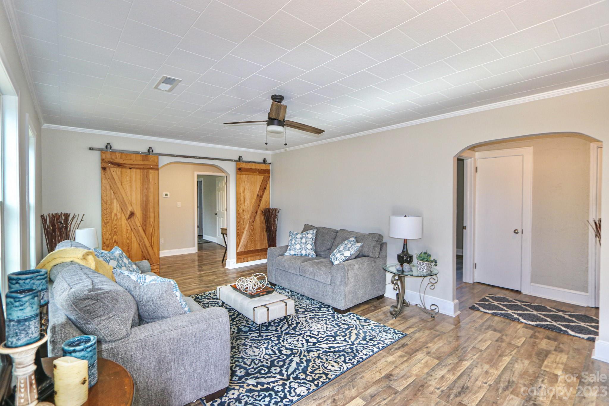 219 Harris Avenue Elkin, NC 28621 - Photo 9 of 48 a living room with furniture and a rug