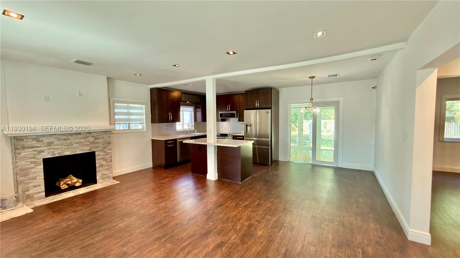 1757 Southwest 24th Terrace Miami, FL 33145 - Photo 14 of 37 a view of kitchen with cabinets and wooden floor