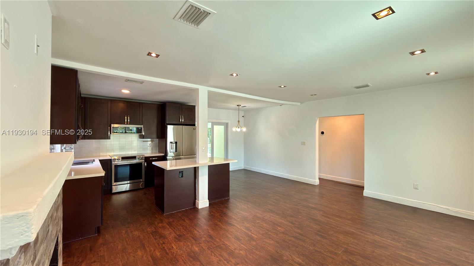 1757 Southwest 24th Terrace Miami, FL 33145 - Photo 15 of 37 wooden floor and dining room view