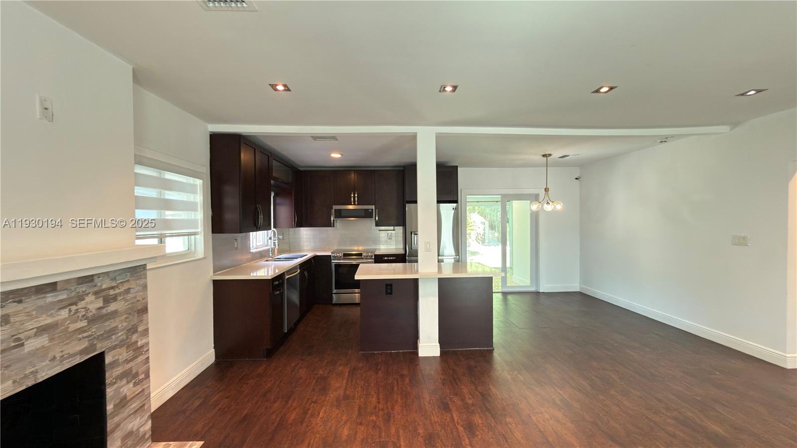 1757 Southwest 24th Terrace Miami, FL 33145 - Photo 16 of 37 a large kitchen with cabinets and wooden floor