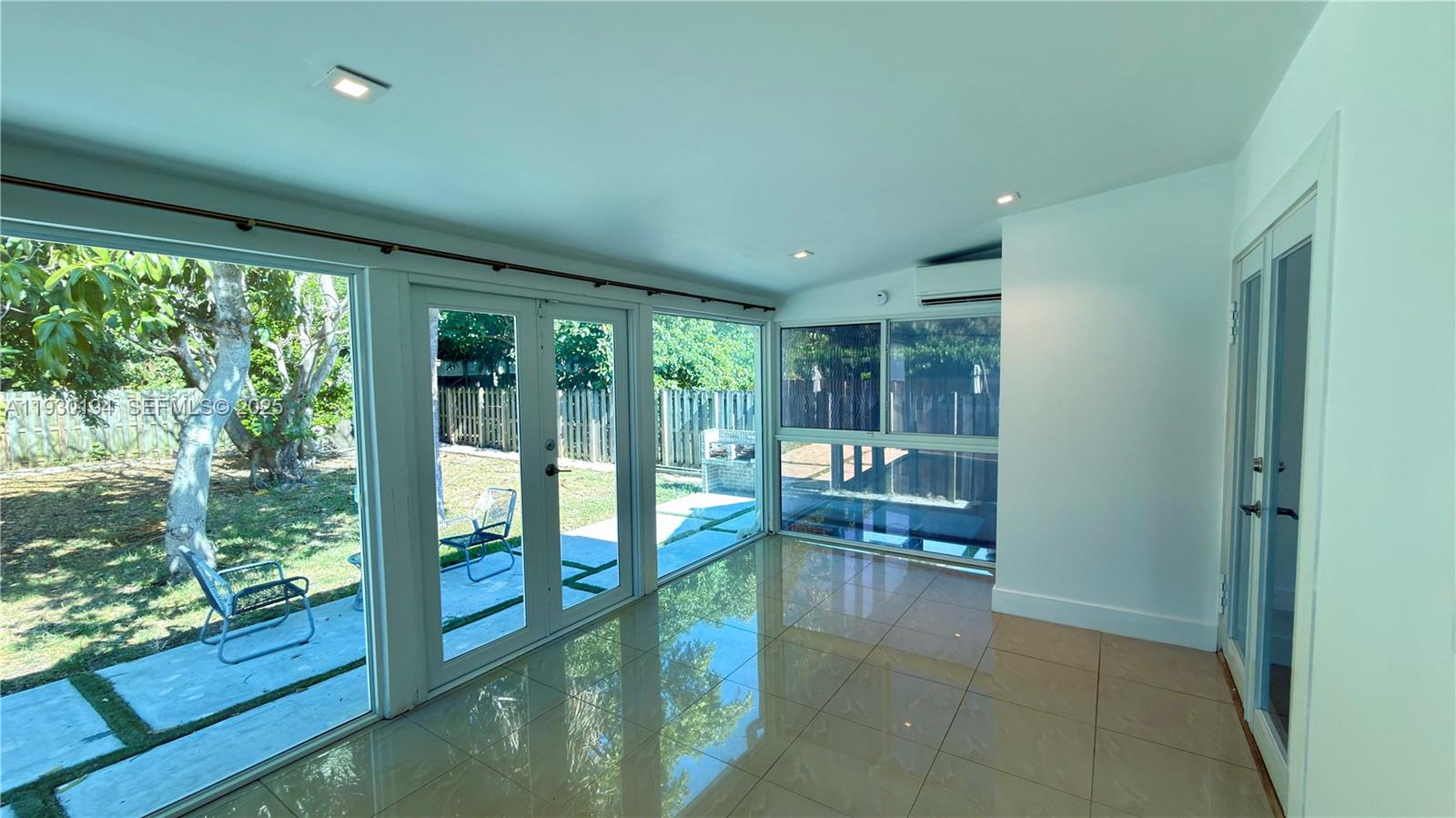 1757 Southwest 24th Terrace Miami, FL 33145 - Photo 18 of 37 a bathroom with a large window and a bath tub