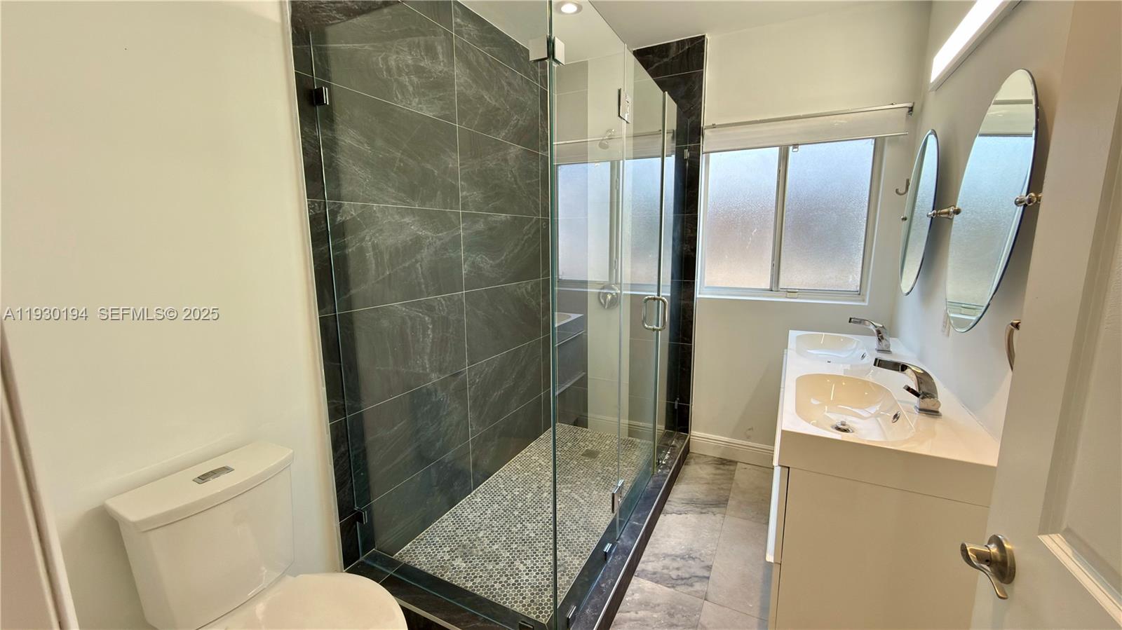 1757 Southwest 24th Terrace Miami, FL 33145 - Photo 25 of 37 a bathroom with a sink toilet and shower