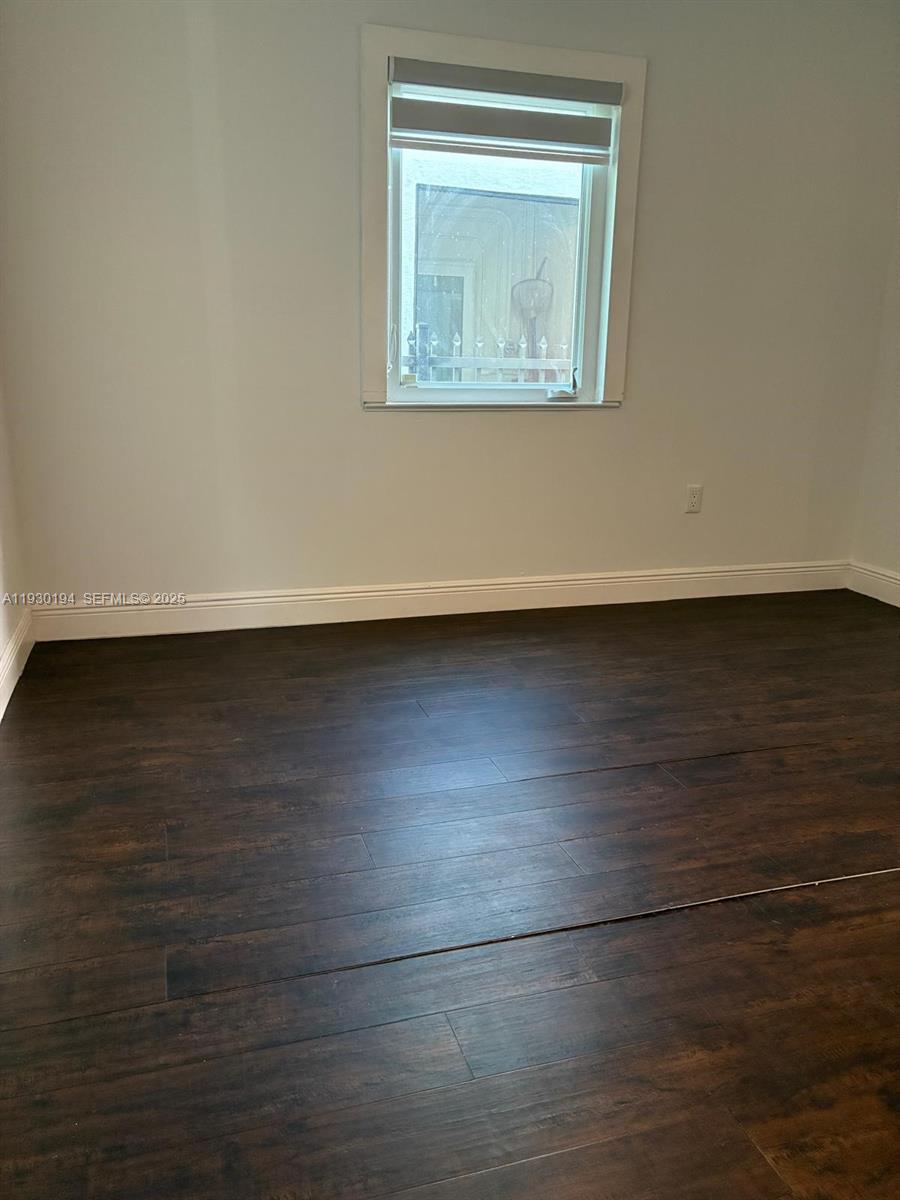 1757 Southwest 24th Terrace Miami, FL 33145 - Photo 29 of 40 a view of a small space with wooden floor and a window