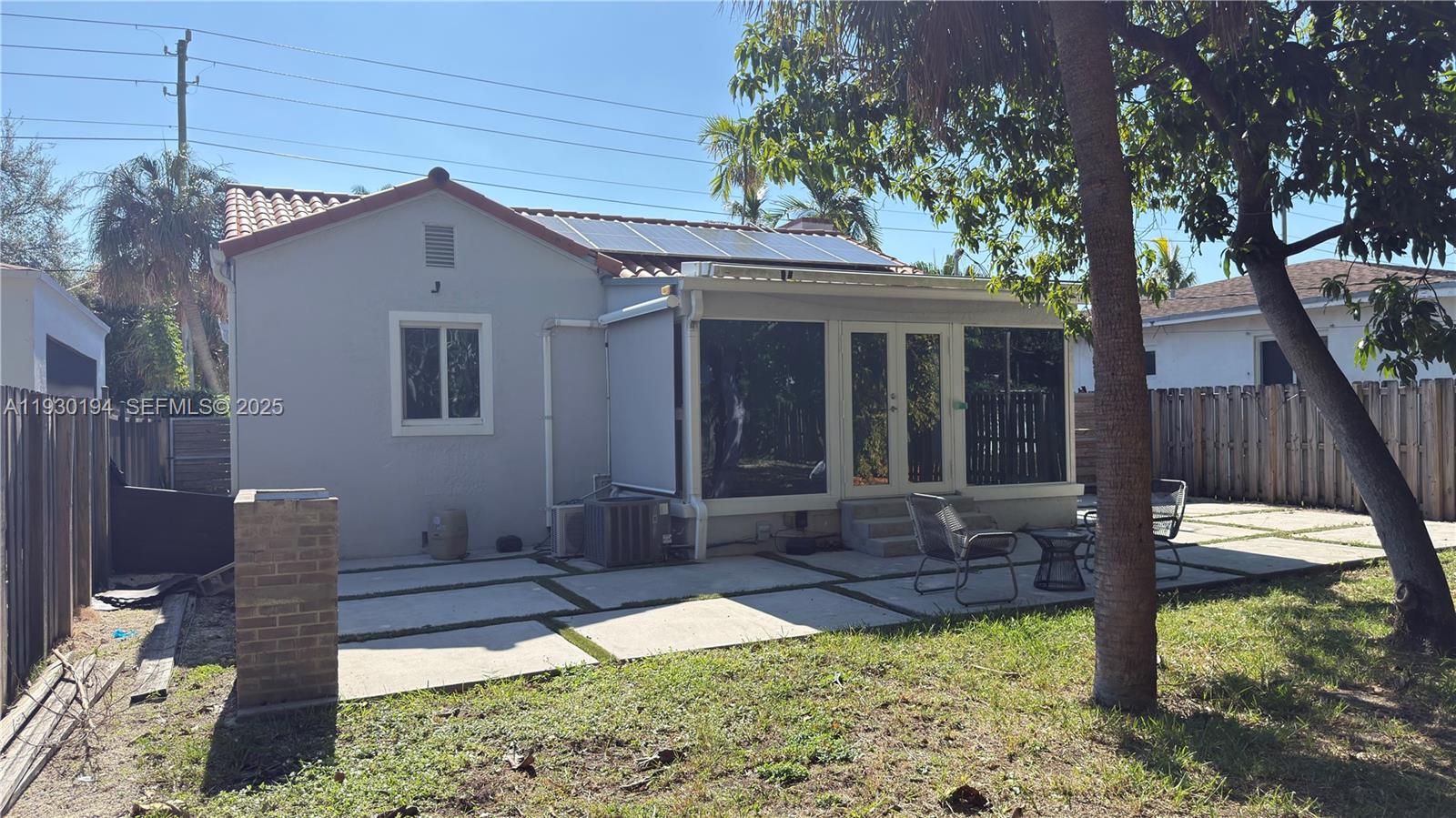 1757 Southwest 24th Terrace Miami, FL 33145 - Photo 30 of 37 a view of a house with backyard and sitting area
