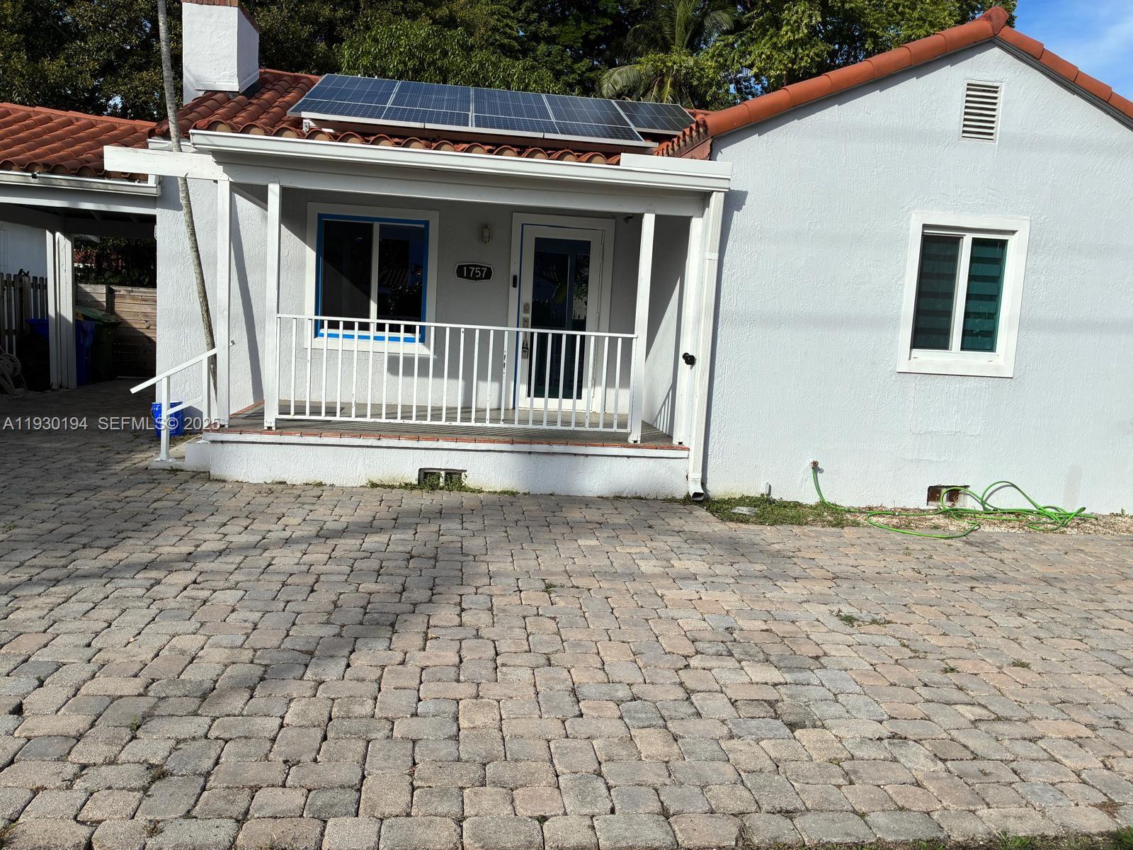 1757 Southwest 24th Terrace Miami, FL 33145 - Photo 3 of 40 a front view of a house with a porch