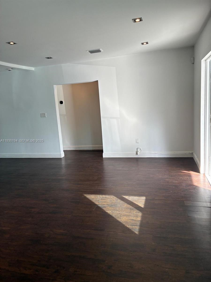 1757 Southwest 24th Terrace Miami, FL 33145 - Photo 34 of 40 an empty room with wooden floor