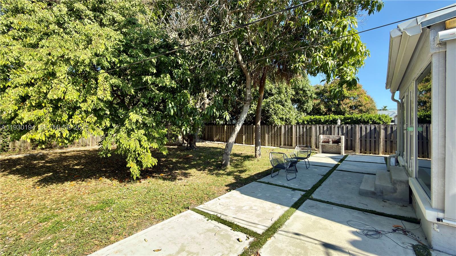 1757 Southwest 24th Terrace Miami, FL 33145 - Photo 34 of 37 a view of a yard with wooden deck