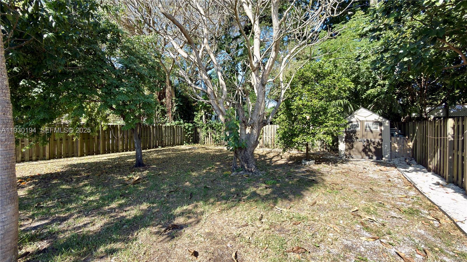 1757 Southwest 24th Terrace Miami, FL 33145 - Photo 35 of 37 a backyard of a house with a trees