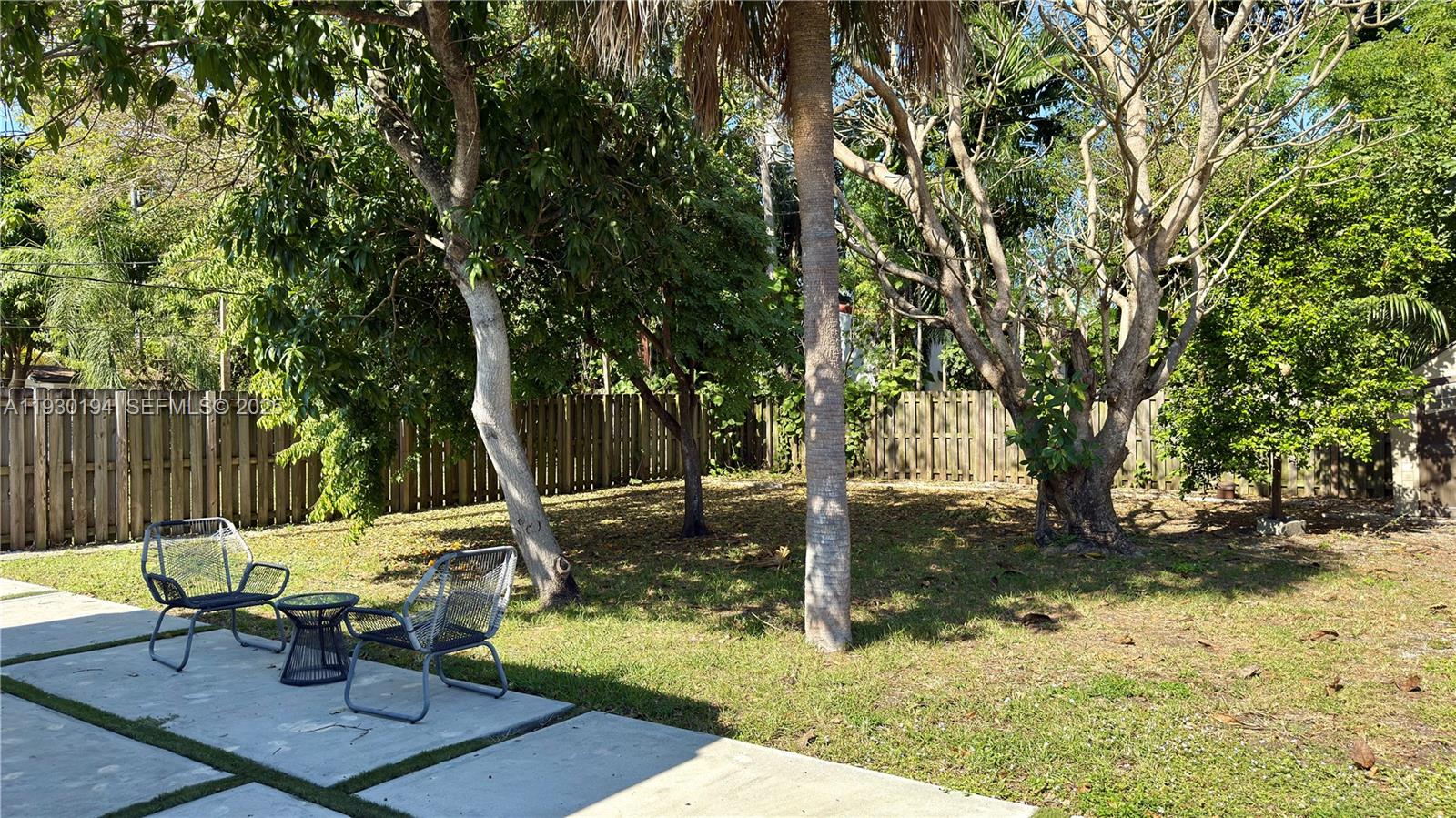 1757 Southwest 24th Terrace Miami, FL 33145 - Photo 36 of 37 a view of a backyard with table and chairs