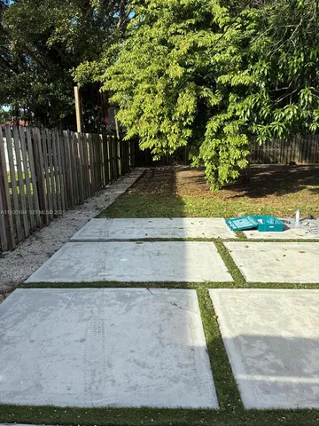 a view of swimming pool with trees