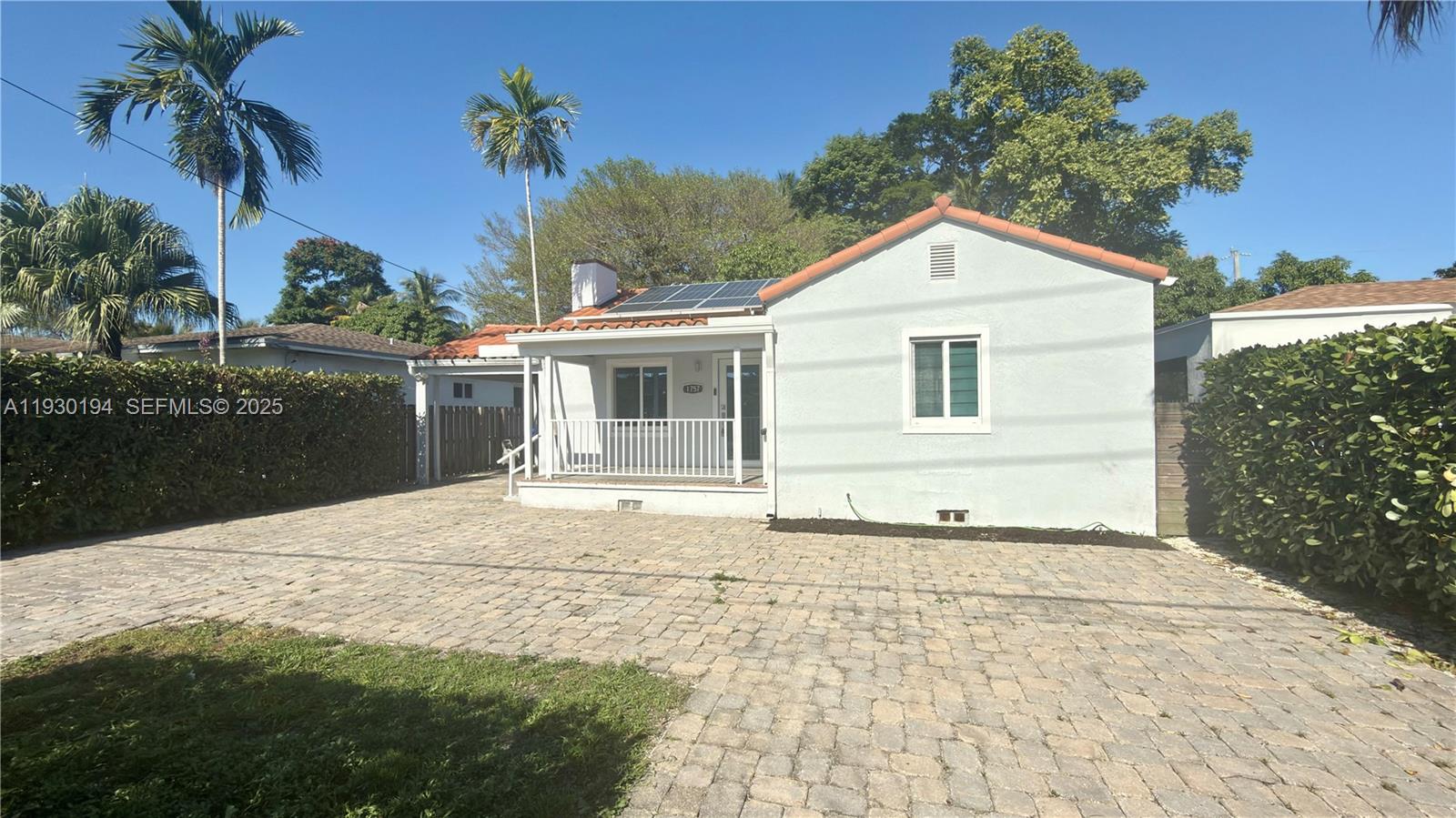 1757 Southwest 24th Terrace Miami, FL 33145 - Photo 4 of 37 a front view of a house with a yard