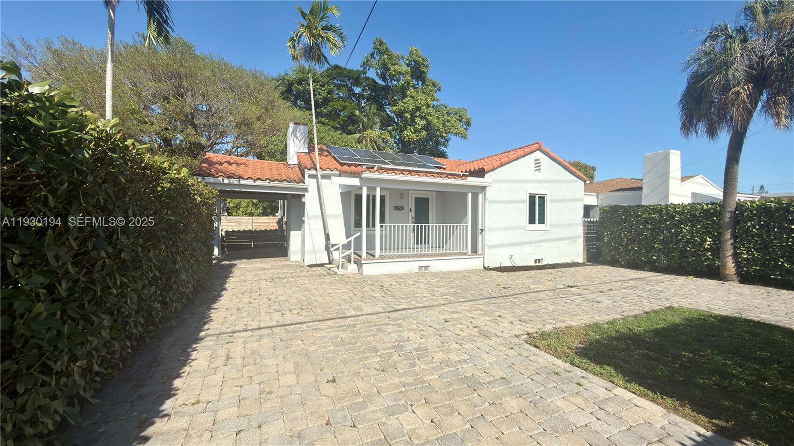 1757 Southwest 24th Terrace Miami, FL 33145 - Photo 5 of 37 a front view of a house with a garden