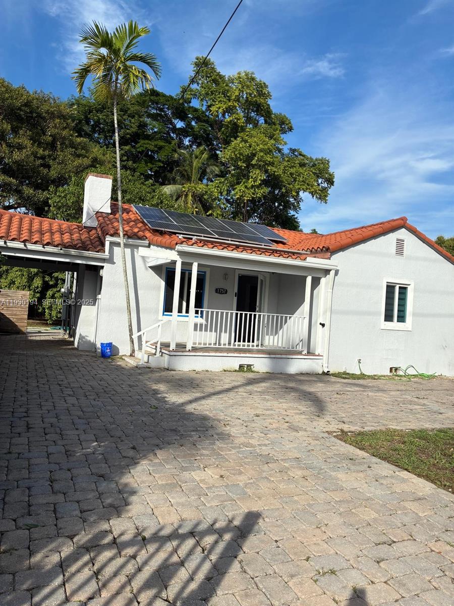 1757 Southwest 24th Terrace Miami, FL 33145 - Photo 6 of 40 a backyard of a house with plants and outdoor seating