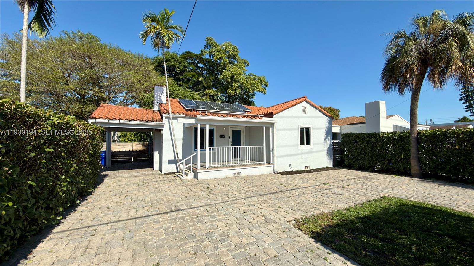 1757 Southwest 24th Terrace Miami, FL 33145 - Photo 6 of 37 a front view of a house with a yard and potted plants