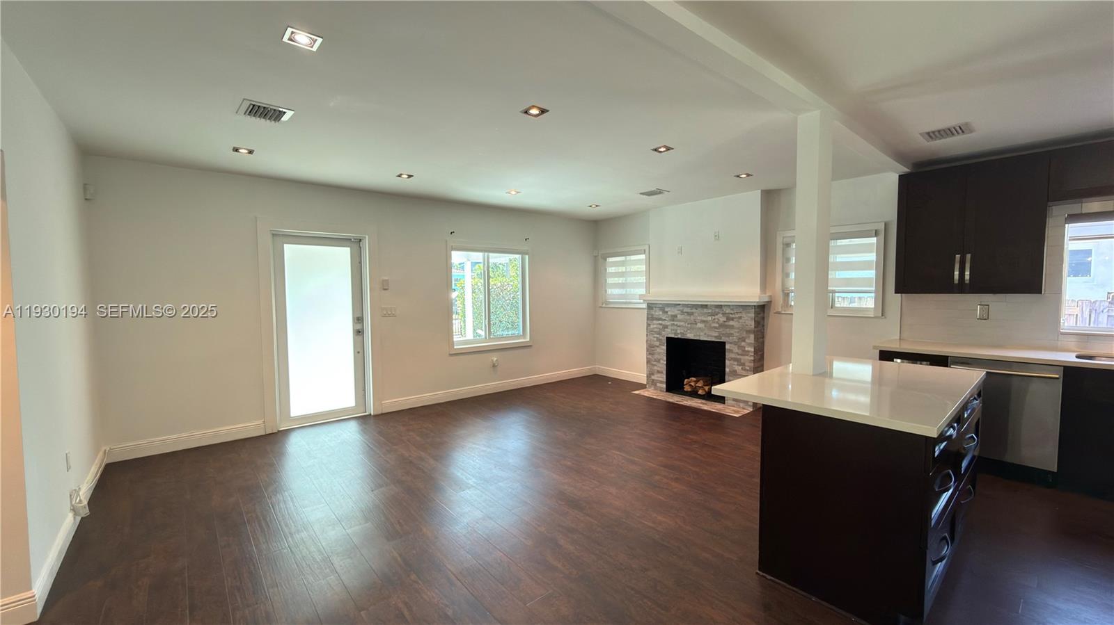 1757 Southwest 24th Terrace Miami, FL 33145 - Photo 10 of 37 a workspace with furniture window and wooden floor