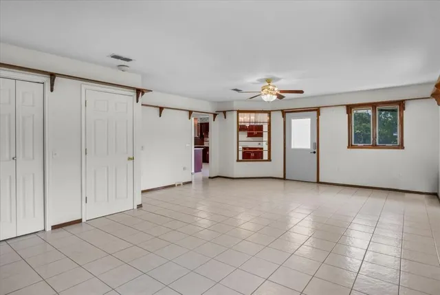 a view of an empty room with a window