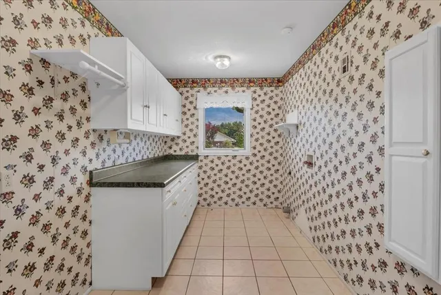 a bathroom with a sink a toilet and a shower
