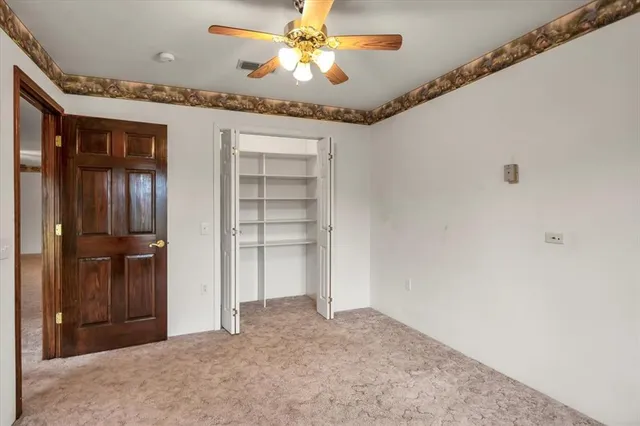 a view of a house with yard and a garden