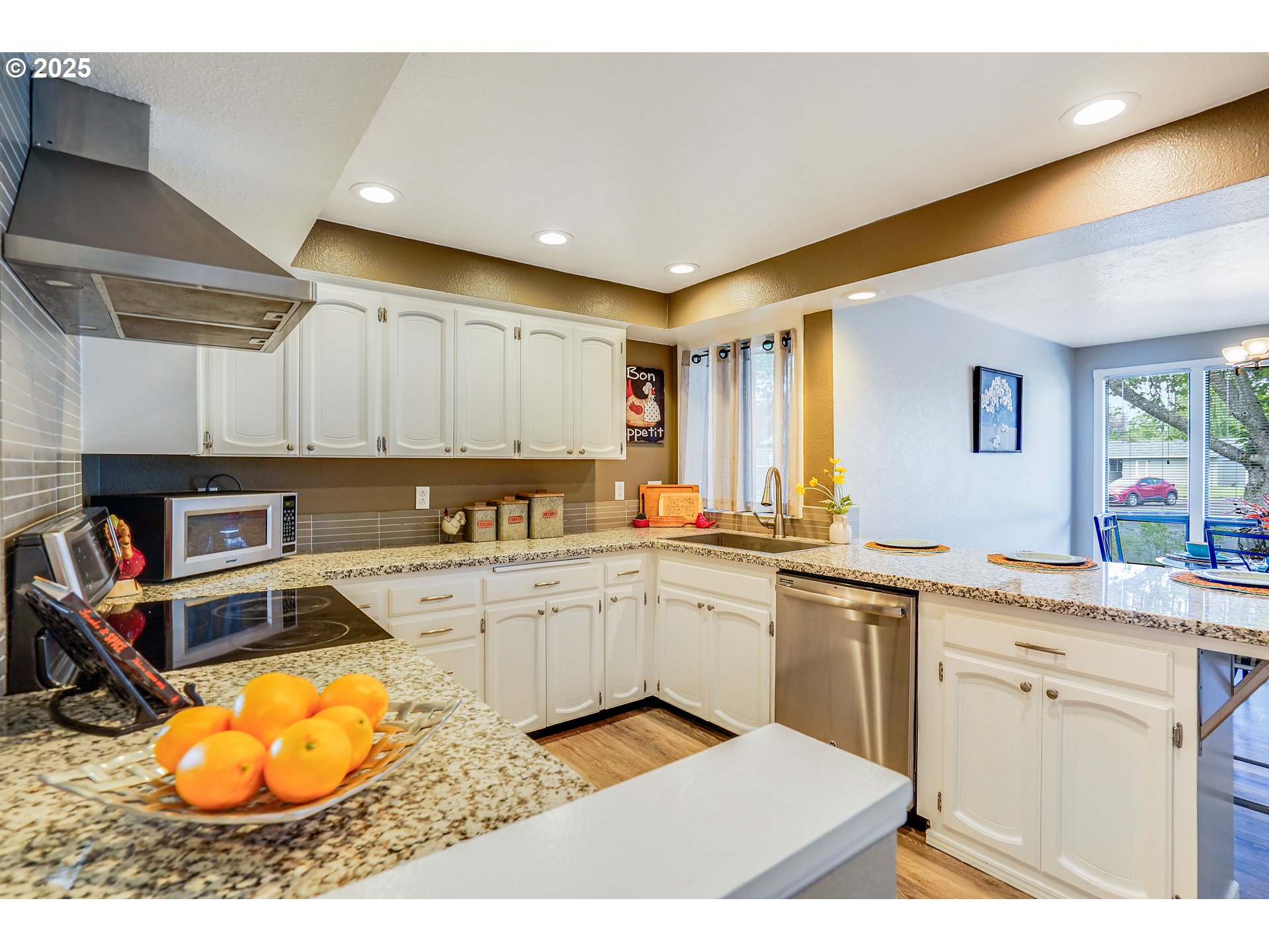 4495 Madrona Way Southeast Albany, OR 97322 - Photo 7 of 29 a kitchen with stainless steel appliances granite countertop a sink and cabinets