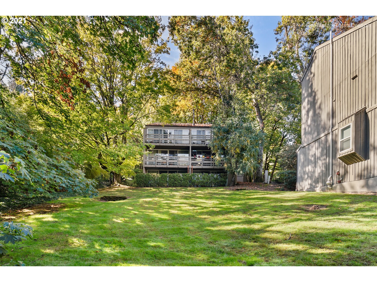 100 Kerr Parkway, Unit 19 Lake Oswego, OR 97035 - Photo 30 of 32 a view of a big yard with potted plants and large tree