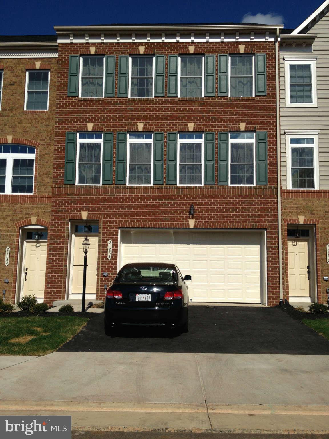 21234 Park Grove Terrace Ashburn, VA 20147 - Photo 1 of 1 a car parked in front of a building