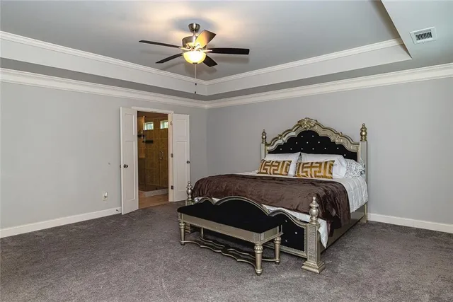 a bed room with a bed and a television