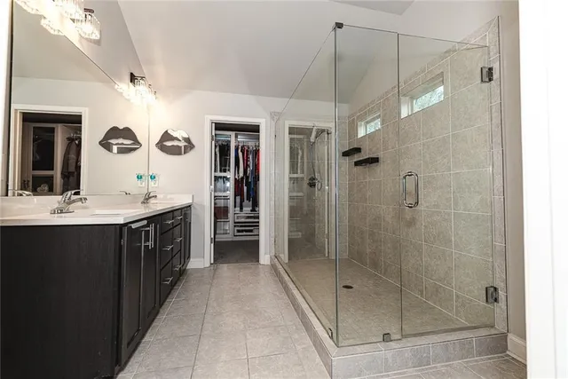 a bed room with a bed and a chair