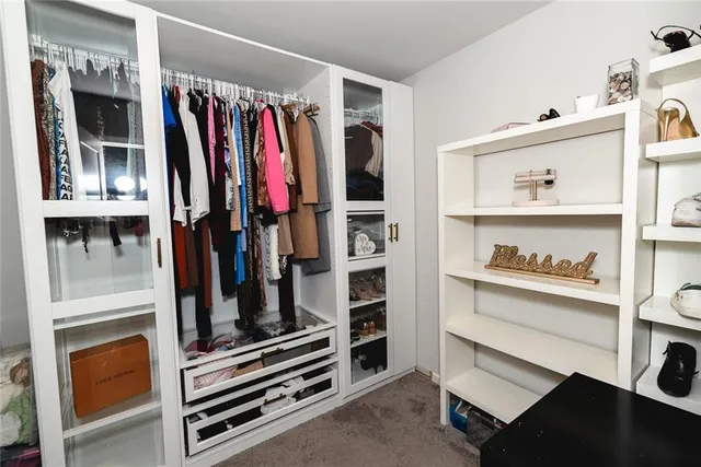 a bathroom with a sink mirror and vanity