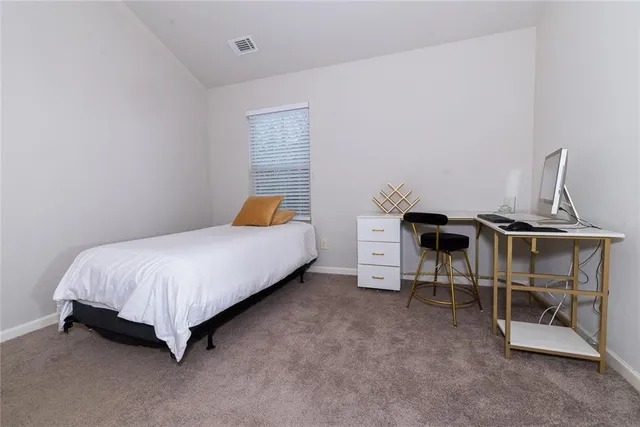 a house is sitting in middle of the garden