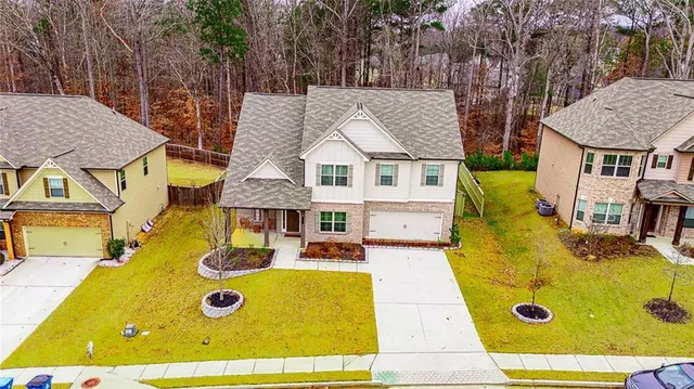 an aerial view of residential house with swimming pool