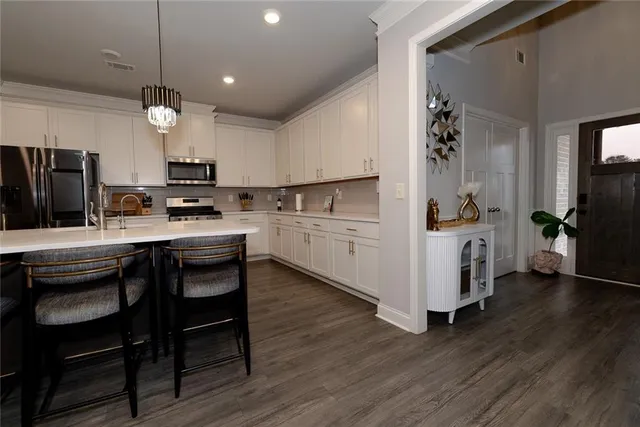 a view of a entryway with wooden floor