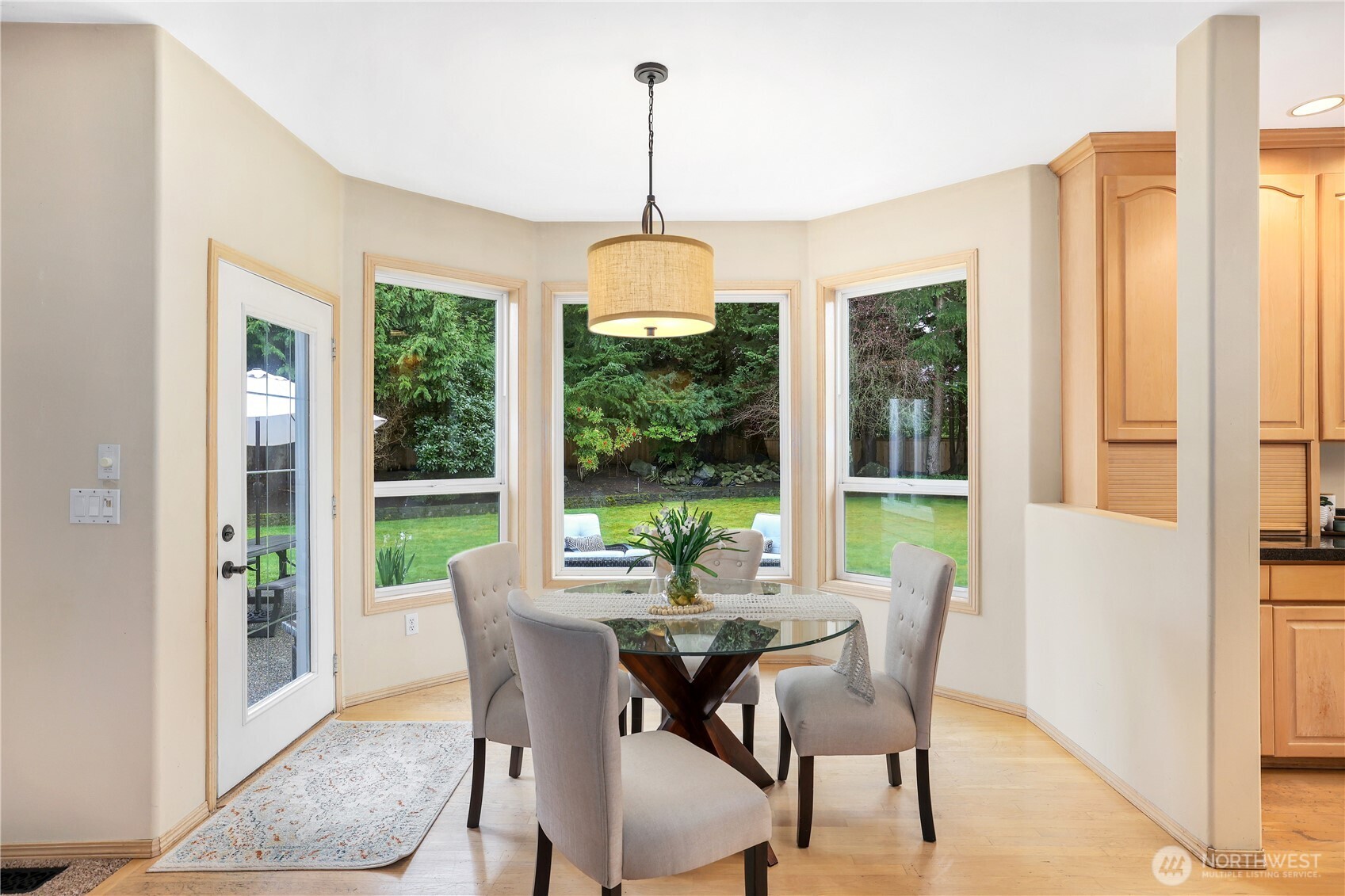 423 Southwest 348th Court Federal Way, WA 98023 - Photo 13 of 39 a dining room with furniture large windows and a chandelier