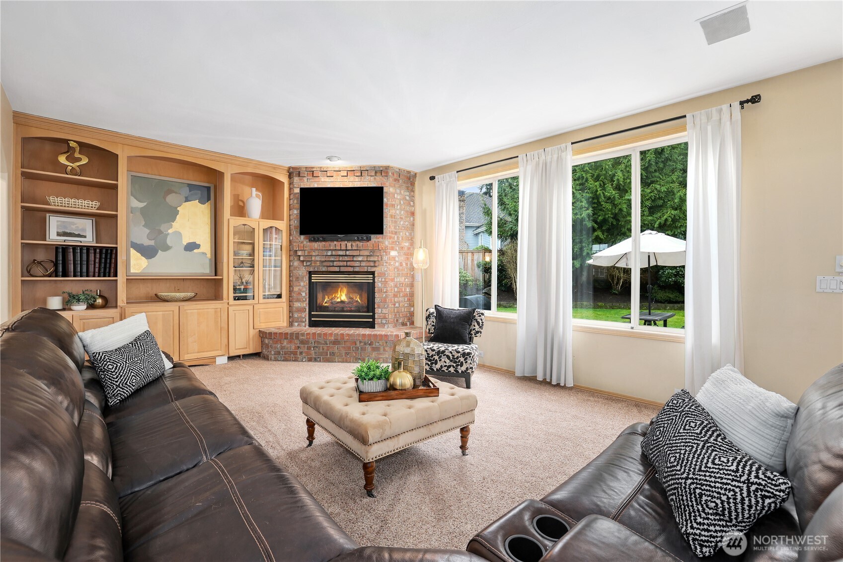 423 Southwest 348th Court Federal Way, WA 98023 - Photo 15 of 39 a living room with furniture a flat screen tv and a large window