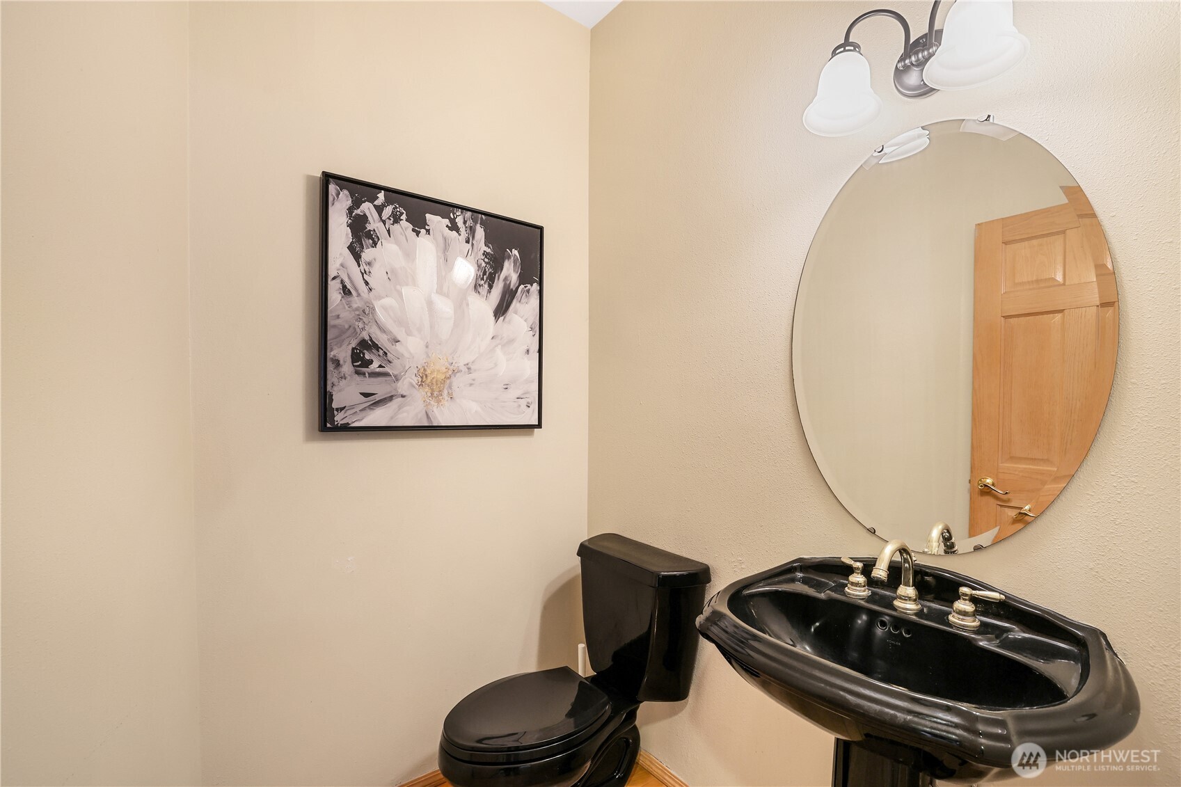 423 Southwest 348th Court Federal Way, WA 98023 - Photo 17 of 39 a bathroom with a sink a mirror and a toilet