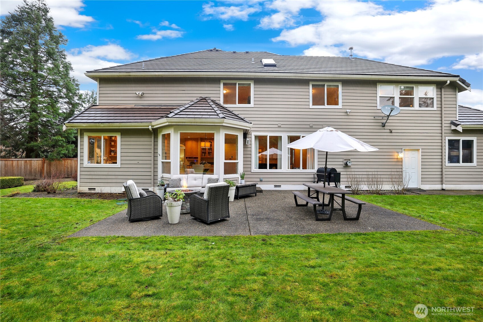 423 Southwest 348th Court Federal Way, WA 98023 - Photo 30 of 39 a view of a house with backyard and sitting area