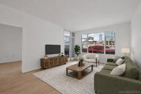 a living room with furniture and a flat screen tv