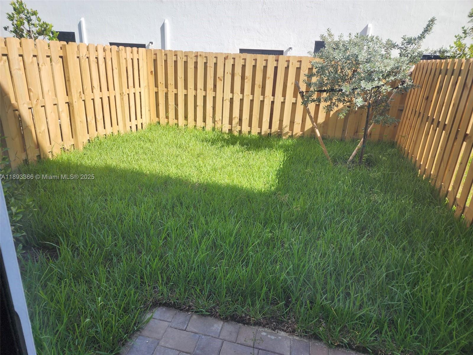 12867 Southwest 232nd Lane, Unit 12867 Homestead, FL 33032 - Photo 6 of 12 a view of garden with deck